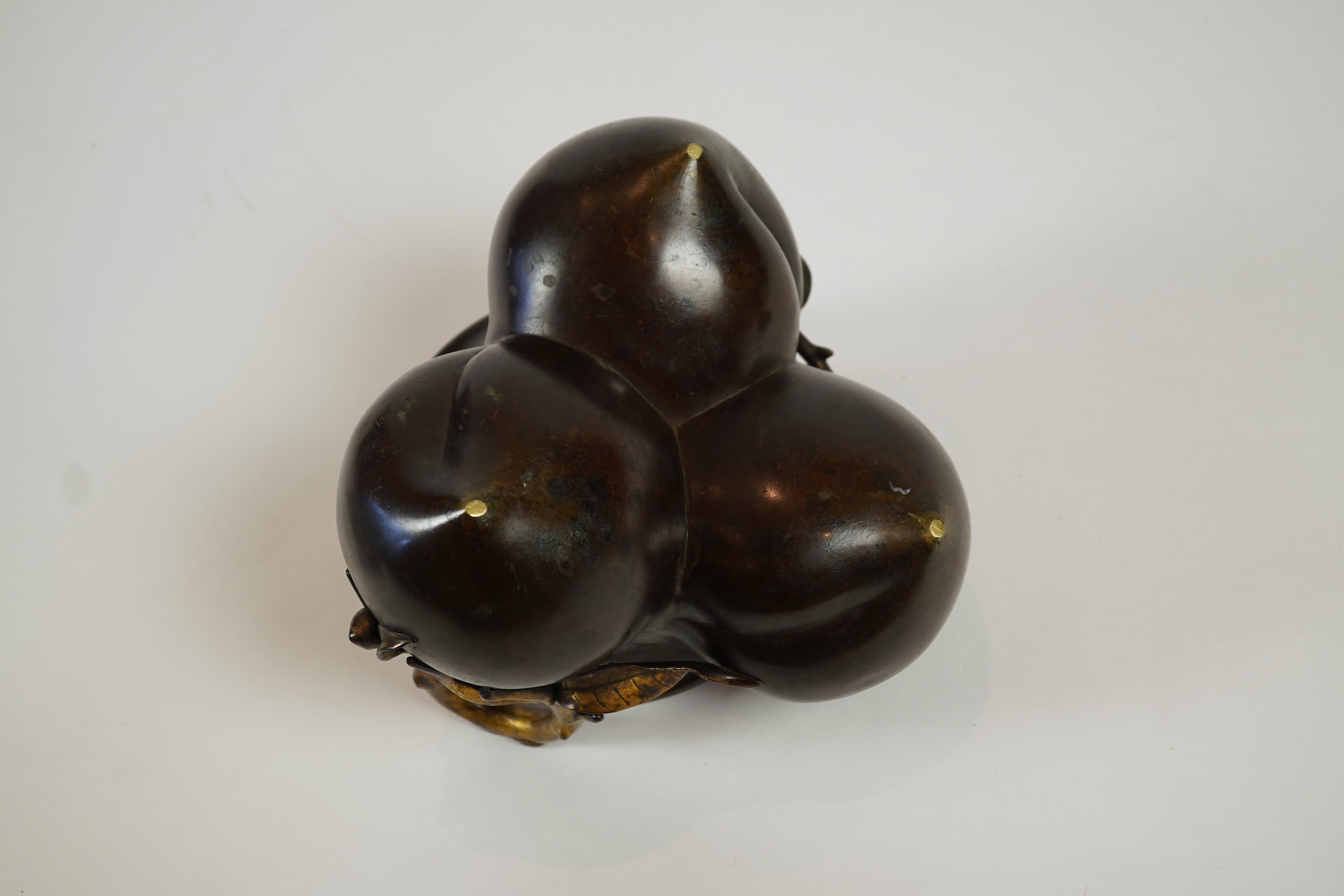 A large Chinese bronze and parcel gilt ‘peach’ censer and cover, Li, 17th/18th century
